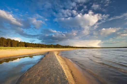 Path on the sea in evening light in summer
