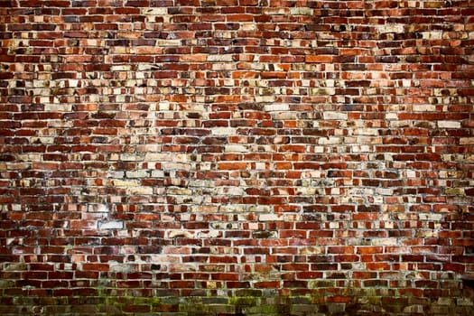 Old red brickwall texture with broken bricks