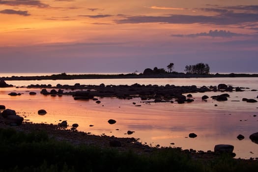 Seacoast at sunset with beautiful sky and reflections