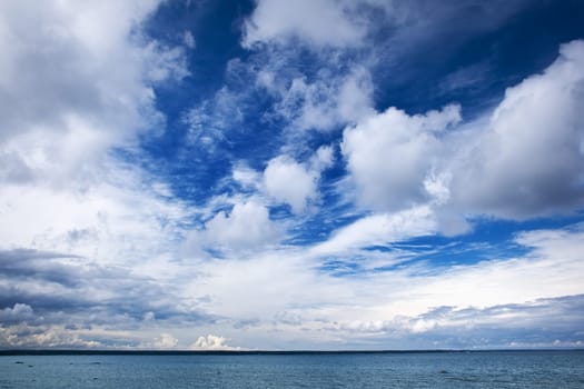 Blue sky with white clouds at the sea
