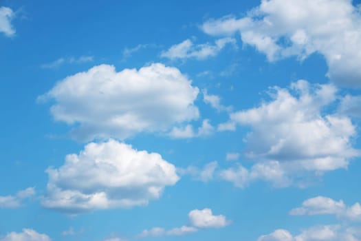 white clouds on the blue sky on sunny day