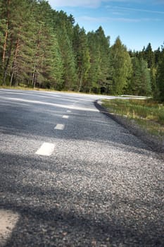 black asphalt road and white dividing lines