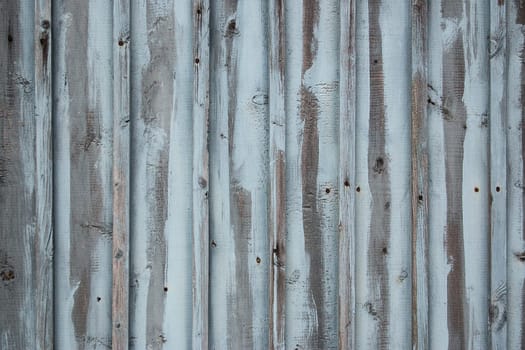 blue weathered wooden wall of an old building