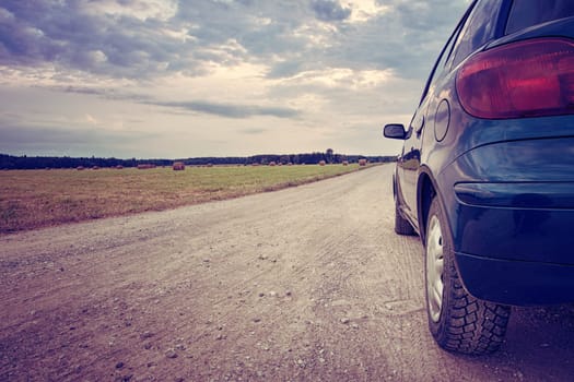 Car in the summer on gravel road