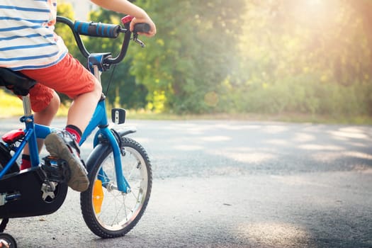 child on a bicycle at asphalt road