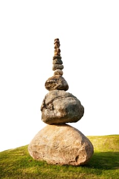 isolated stacked stones on the grass in summer