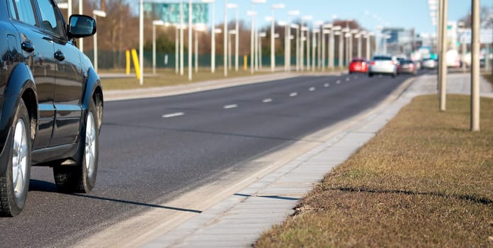 Blurred background of cars on asphalt road