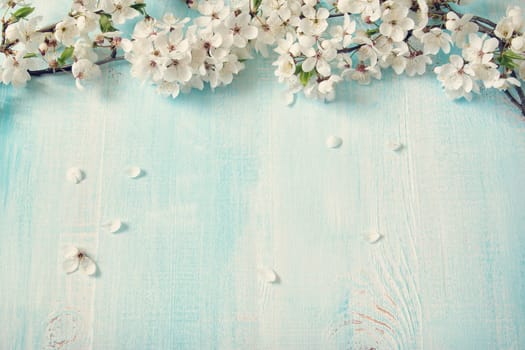 fresh cherry flowers on old wooden board