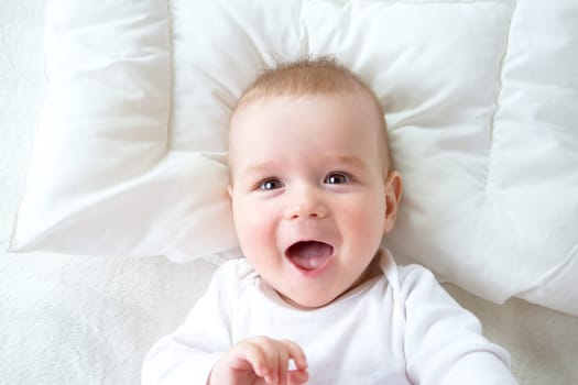 seven month old boy in the bed