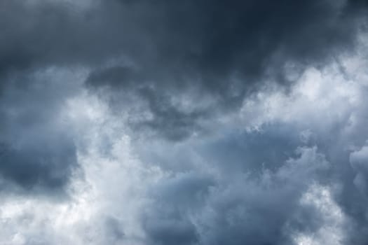 Dramatic clouds on the blue sky on sunny day