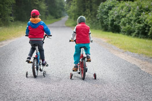 child on a bicycle at asphalt road