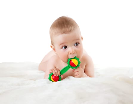 Baby holding a toy isolated on white background
