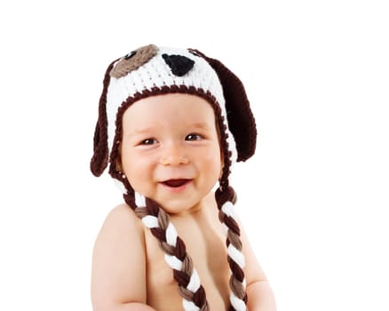 happy baby in dog hat smiling isolated on white background