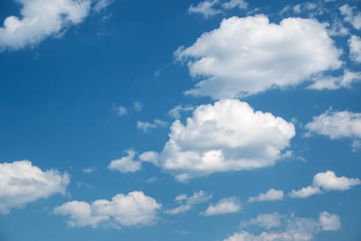 white clouds on the blue sky on sunny day