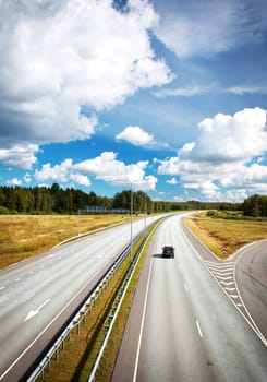 Motorway in summer with beautiful white clouds