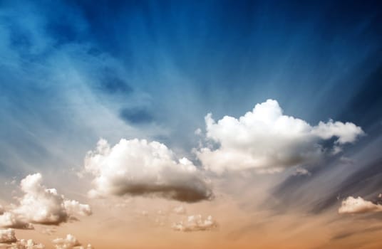 Fluffy clouds on the blue sky on sunny day