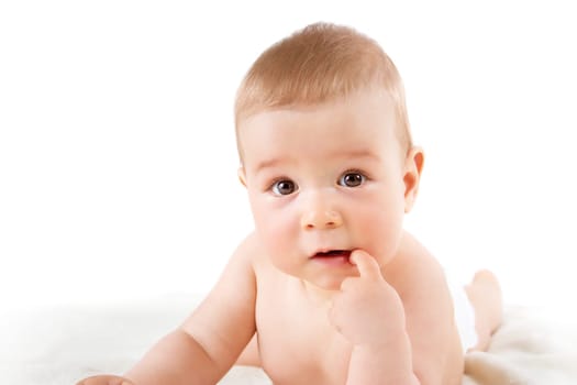little baby isolated on white background lying on soft blanket