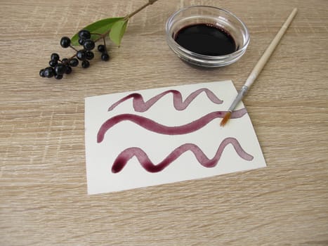 Painting with black violet plant ink made from privet berries
