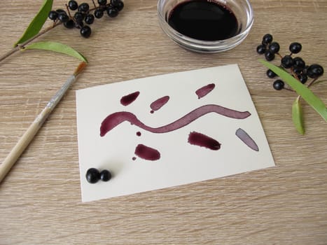 Painting with black violet plant ink made from privet berries