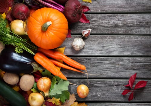 mixed vegetables on old weathered wooden background