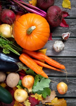 mixed vegetables on old weathered wooden background