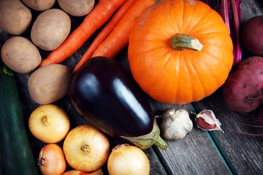 mixed vegetables on old weathered wooden background