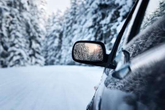 car on winter road in the morning