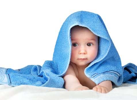 Cute eight month old baby wrapped in a towel isolated on white background