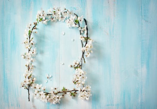 fresh cherry flowers on old wooden board