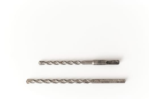 Concrete drill bits isolated on white. SDS hammer bit and drill concrete bit.