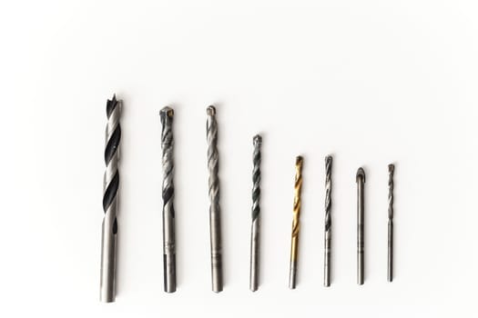 Drill bits for wood and concrete of different sizes isolated.