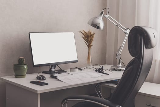 Modern stylish home office workplace. White, black and chrome colors. Blank screen for pasting image