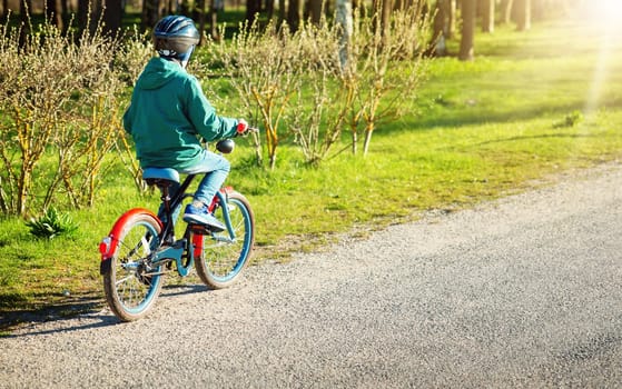 child on a bicycle at asphalt road