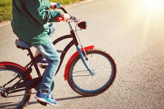 child on a bicycle at asphalt road