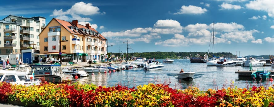 VAXHOLM, SWEDEN - JUNE 25, 2016: Cruise boats at little cosy island Vaxholm near Stockholm