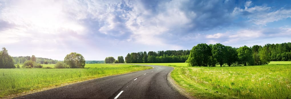 asphalt road panorama in countryside on beautiful evening