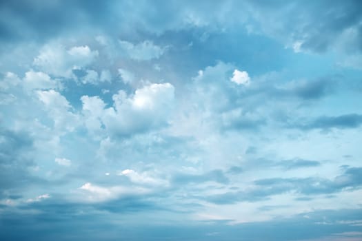 Dramatic clouds on the blue sky on sunny day