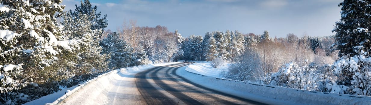 Car on winter road covered with snow