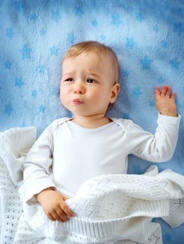 One year old baby crying in bed