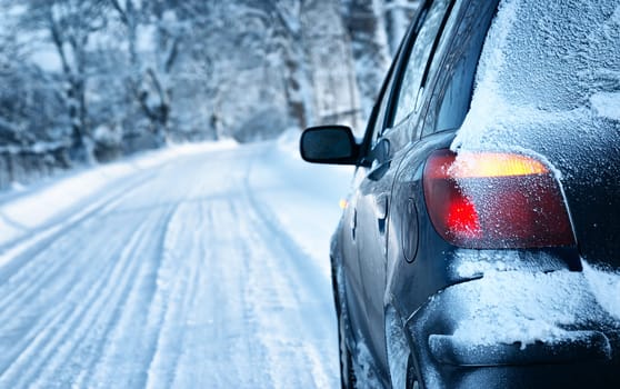 car on winter road in the morning