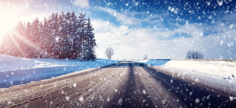 Car on winter road covered with snow
