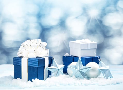 Blue gift boxes with christmas decoration on beautiful background
