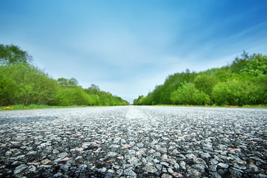 Asphalt road in beautiful spring day at countryside