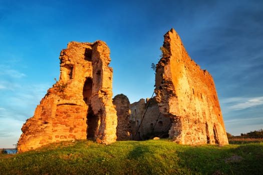 Old castle ruins in sunset light. Toolse in northern Estonia