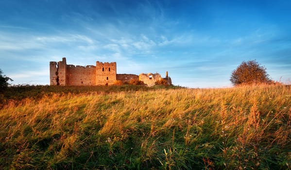 Old castle ruins in sunset light. Toolse in northern Estonia