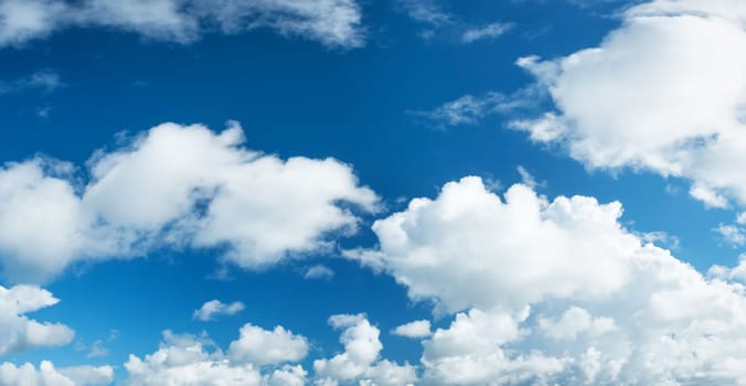 white clouds on the blue sky on sunny day