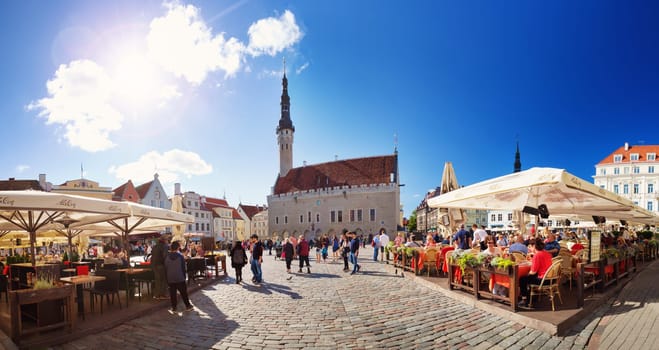 TALLINN, ESTONIA - MAY 24: View to Tallinn Town Hall on August 14, 2017 in Tallinn. Town hall with lots of tourists in the middle of summer