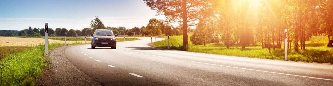 asphalt road view in countryside at beautiful sunset