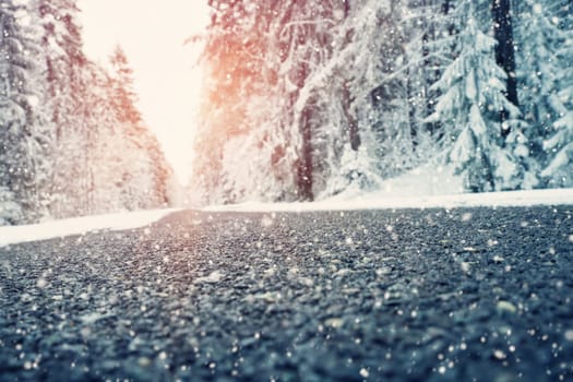 Asphalt road in snowy winter on beautiful frosty day