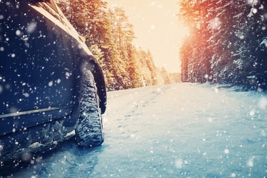 car on winter road in the morning